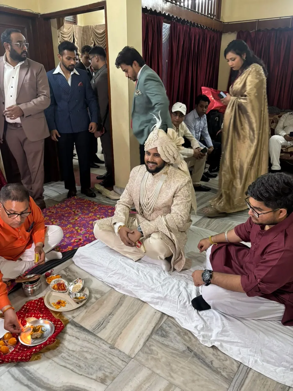 Original wedding ceremony photograph featuring a groom in an ivory pagri and sherwani
