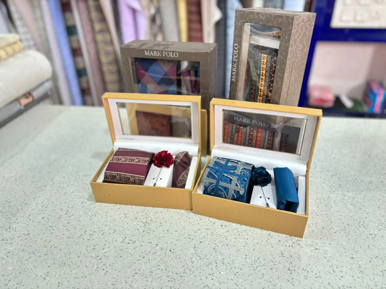 Wedding pagri and accessory gift kits on display